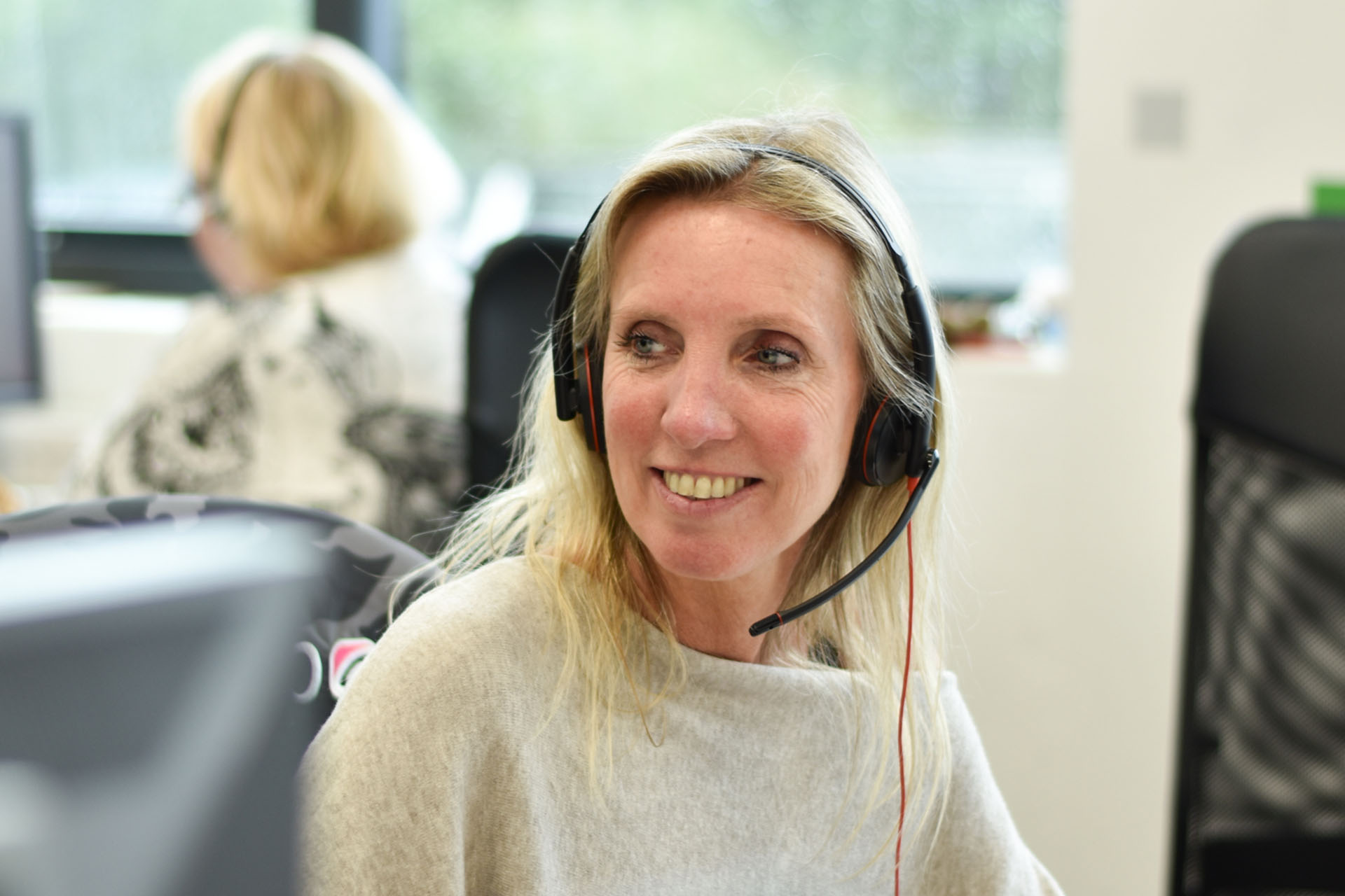 An outsourced telemarketer on a phone call